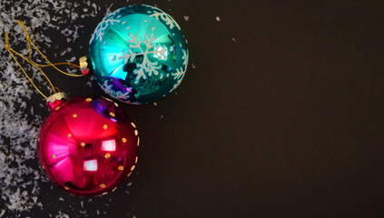      ..beautiful black christmas background for postcards, flyers, banners. Christmas tree branch and Christmas balls and toys
