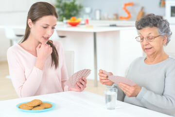 women playing cards with grandma