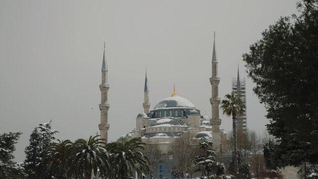 Snow covered Sultanahmet (Blue Mosque) in winter season, sky is clouded over, Istanbul Turkey, Sultan Ahmet after snowfall