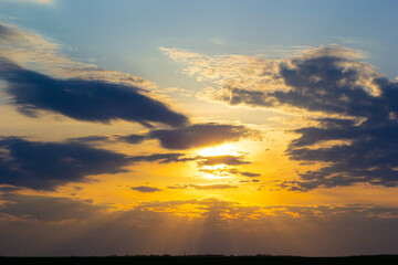 sunset sky with multicolor clouds. Dramatic twilight sky background