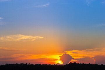 sunset sky with multicolor clouds. Dramatic twilight sky background
