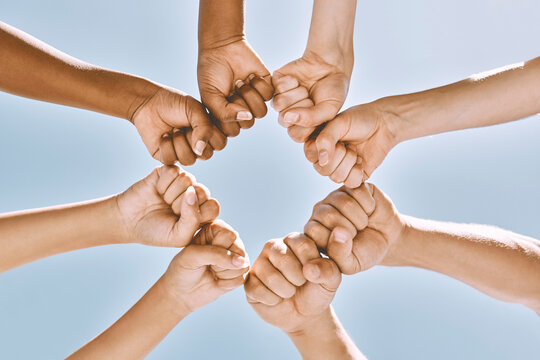 Support, trust and solidarity fist hands circle with low angle for loyalty, mission and friends with cooperation. Connection, hope and community of people together for social commitment.