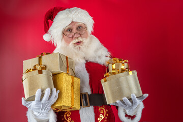 Emotional senior male model old man with a natural white beard in the role of Father Christmas