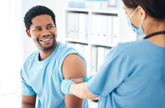 Doctor, vaccine and covid bandaid on arm of man patient for healthcare, medical vaccination and consultation. Hospital nurse with a plaster for an injury, virus or safety while sick and face mask