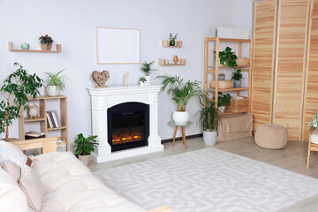 Stylish living room interior with fireplace, houseplants and carpet