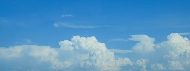 Beautiful blue sky with white fluffy clouds. Banner design