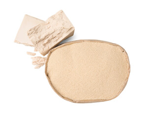 Compressed and granulated yeast on white background, top view