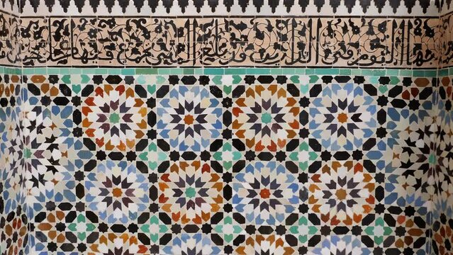 Moroccan interior design with tiles and carved plasterwork, in traditional Arabic Andalusian architecture. 4k footage.