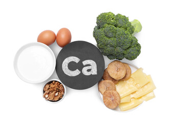 Set of natural food high in calcium on white background, top view