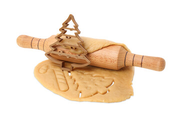 Cookie cutter in shape of Christmas tree, dough and rolling pin isolated on white