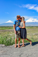 A man with a girl on the background of a beautiful view of mount Ararat in the afternoon. May 6, 2019. Armenia.