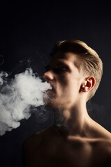 portrait of a smoking man on a black background. Topics of negative habits and bad effects on the body