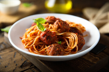 Traditional spaghetti with meatballs and tomato sauce