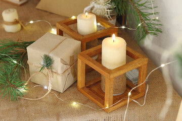 Golden Christmas candles burning, festive atmospheric lights composition.