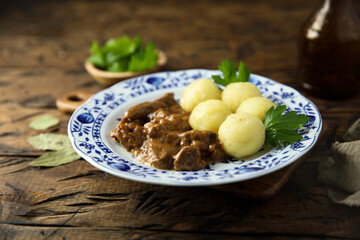 Homemade beef goulash with potato dumplings