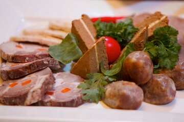 Assorted meat cuts on the festive table.