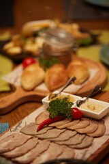 Assorted meat cuts on the festive table.