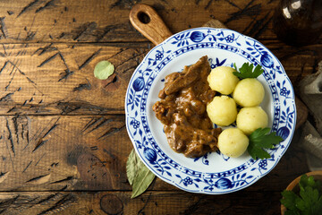 Homemade beef goulash with potato dumplings