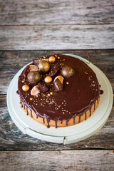 New Year's Eve chocolate cake decorated with gold chocolate balls