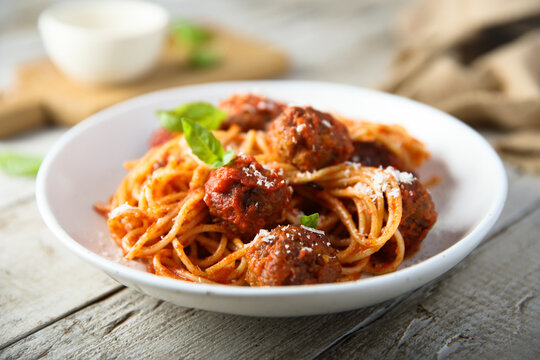 Traditional spaghetti with meatballs and tomato sauce