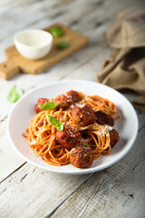 Traditional spaghetti with meatballs and tomato sauce