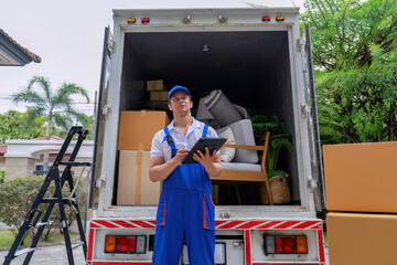 Delivery house move cargo truck service man checking box list from digital tablet for signature