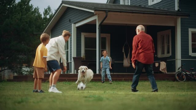 Grandfather Playing Ball with His Son and Grandchildren. Family Members Spending Leisure Time Outside with Kids and Pet Dog. People Throwing the Ball Between Each Other, Having Fun in Their Front Yard
