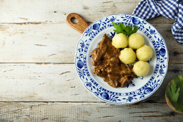Homemade beef goulash with potato dumplings