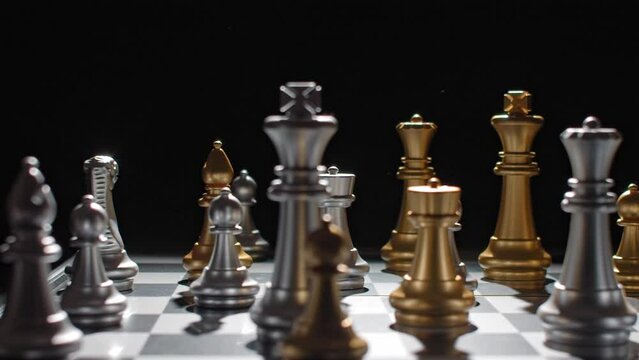 Angry hand of a losing chess player wiping pieces off the board.