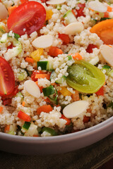 Couscous with vegetables in a rustic bowl. Moroccan couscous. Selective focus.