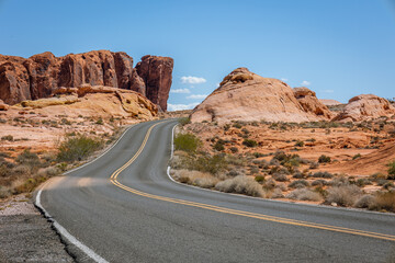 Driving and walking through the Valley of Fire State Park, formed by shifting sand dunes to red sandstone formations, also called Aztec Sandstone, Nevada, USA