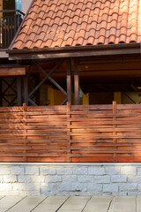 Wooden fence near house on sunny day outdoors