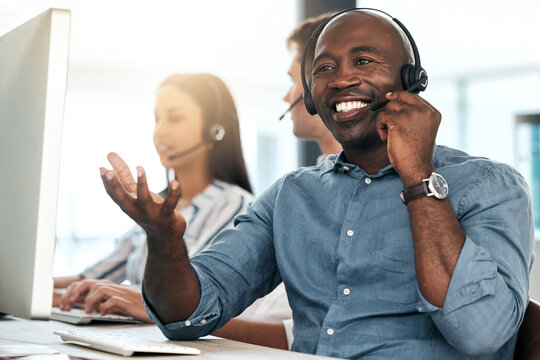 Call center, black man and talking for customer service, smile and headset in office. Telemarketing, happy male consultant or client support for sales growth, consulting and conversation for business