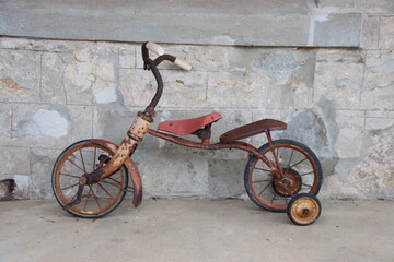 Fototapeta na wymiar Old child's bicycle, Quaalup Homestead, Western Australia.