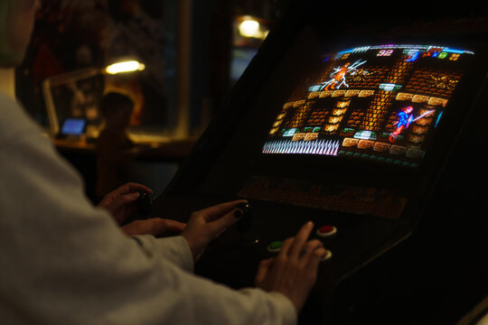 Tallinn, Estonia - 21.05.2022: LVLup! Video Game Museum - People playing video game