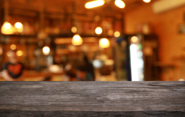 Empty wooden table in front of abstract blurred background of coffee shop . can be used for display or montage your products.Mock up for display of product