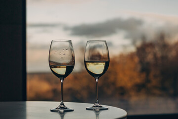 Two glasses against the background of an autumn landscape