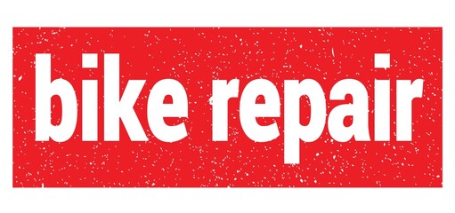 bike repair text written on red stamp sign.