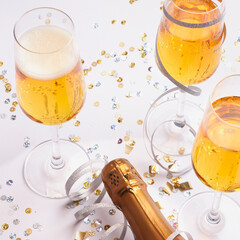 festive champagne glasses with bottle ready for new year
