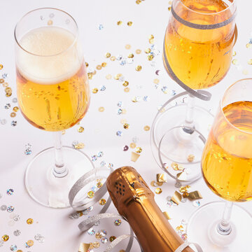 festive champagne glasses with bottle ready for new year