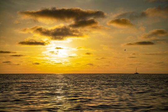 Sunrise on the medditerranean sea with a boat Valras France. Beautiful orange sky