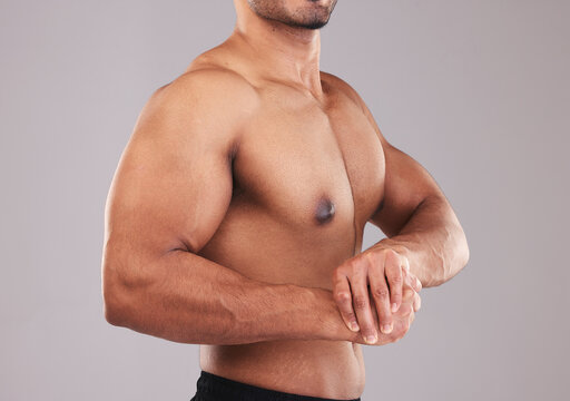 Bodybuilder, muscle flex and strong man in studio for fitness, wellness and sports motivation. Strength, power and healthy body builder athlete, model and proud champion, biceps and topless training