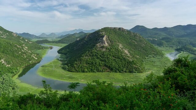 Boats on beautiful river Rijeka Crnojevica between mountains flowing into Skadar Lake, Montenegro, timelapse 4k