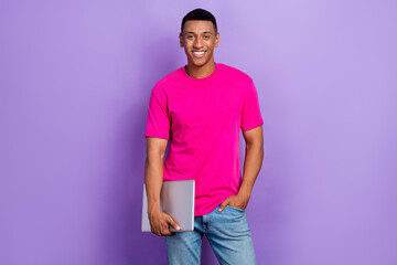 Photo of nice handsome positive guy box haircut dressed pink t-shirt hold laptop hand in pocket...