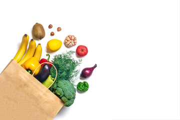 Eco friendly paper shop bag with raw organic green vegetables isolated on white background Flat lay, top view Zero waste, plastic free concept Healthy clean eating diet and detox, agriculture concept