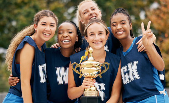 Trophy, sports and winner women team celebration portrait for international netball competition or game event with support, teamwork and achievement. Excited athlete girl group winning a prize goal