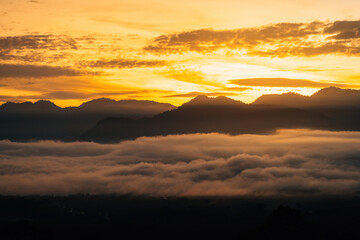 Sea clouds during golden sunrise above the Titiwangsa range mountains in Lenggong, Perak.