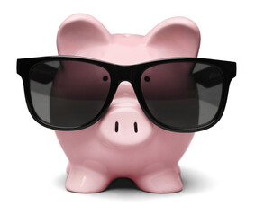 Piggy bank with sunglasses isolated on white