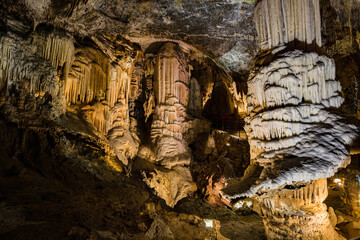 Under the ground. Beautiful view of stalactites and stalagmites in an underground cavern - Postojna...