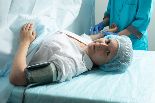 Female patient in operating room at hospital, ready to cesarean section